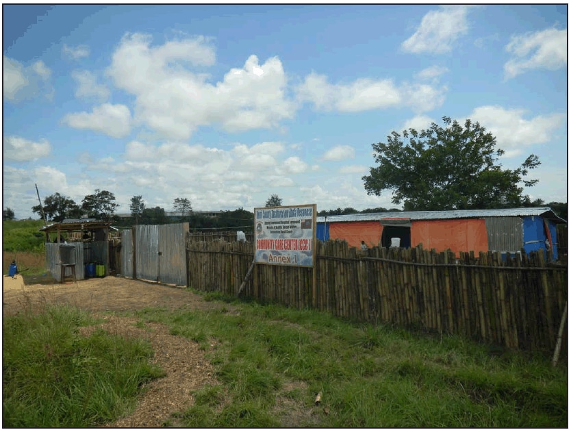The figure is a photograph of the community care center in Bomi County, Liberia. In March 2014, the Bomi County Community Health Department built the isolation ward for Ebola patients adjacent to the county’s single hospital after receiving news of the first Ebola case in Liberia.